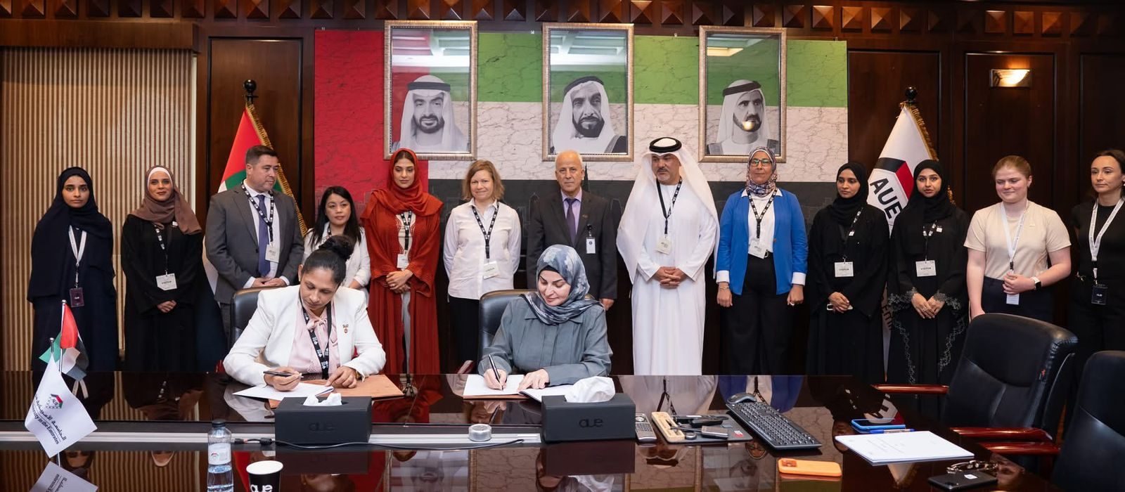 MoU signing ceremony between CMS Holoul and AUE โ full boardroom view